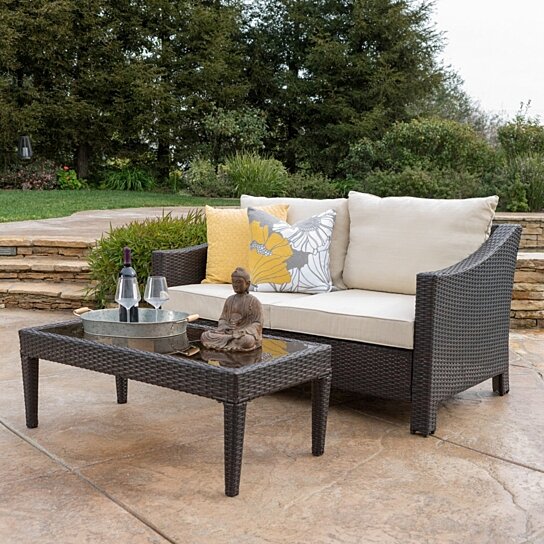 outdoor wicker loveseat and table